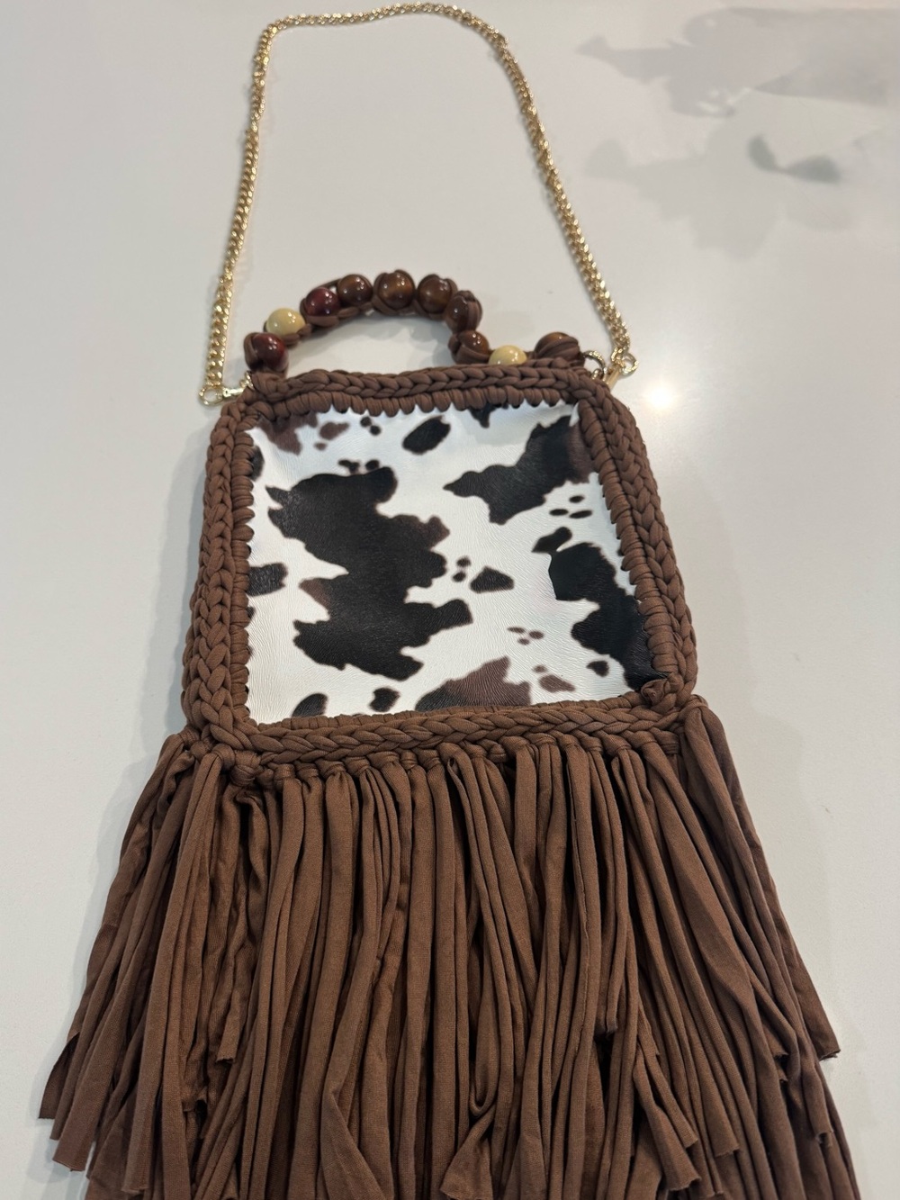 Bonita Bolso Handmade Brown Fringe Crossbody with Cow Print Panel and Gold Chai
